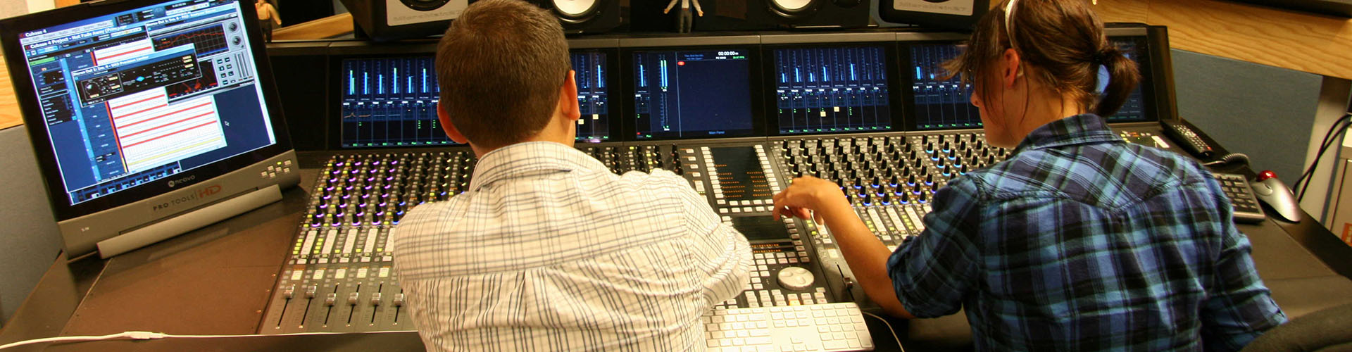 students working in a recording studio