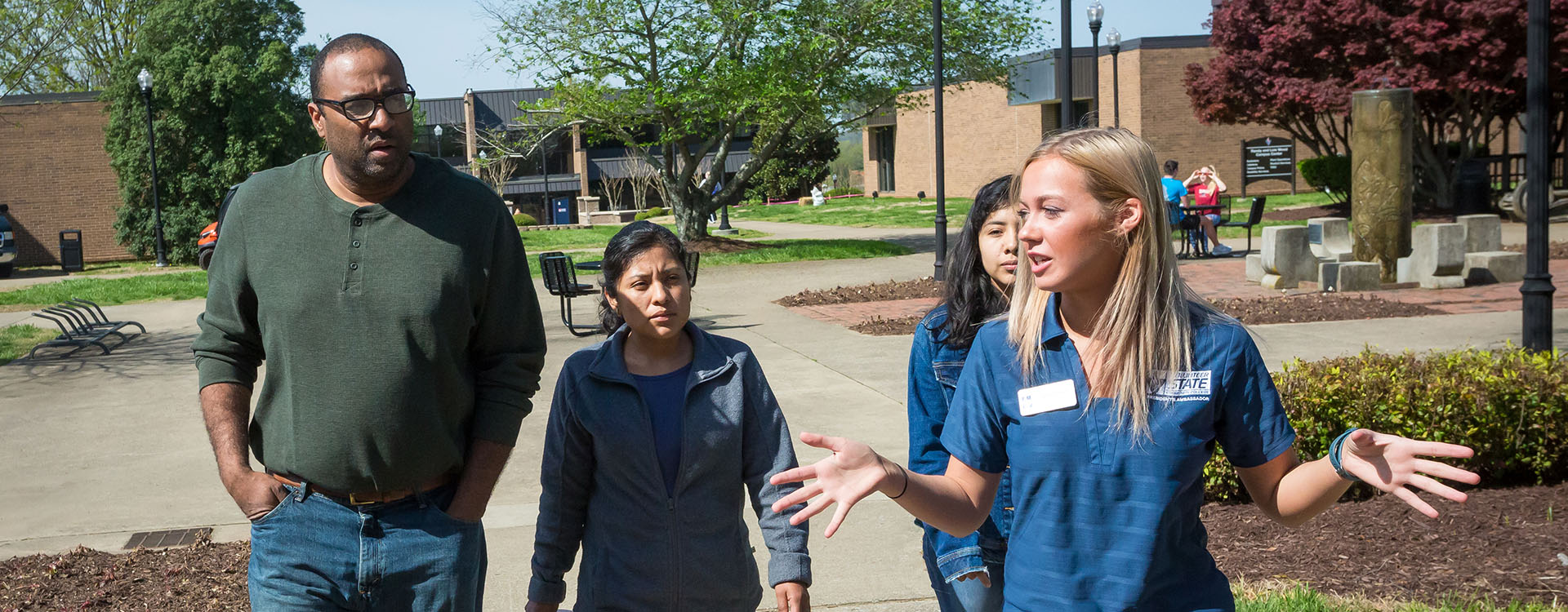 a campus tour guide leading a group