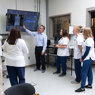 instructor explaining how to read an x-ray image
