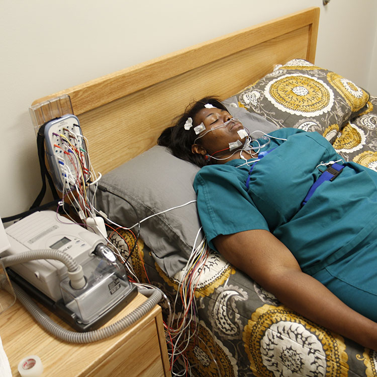 patient sleeping with monitoring equipment in place