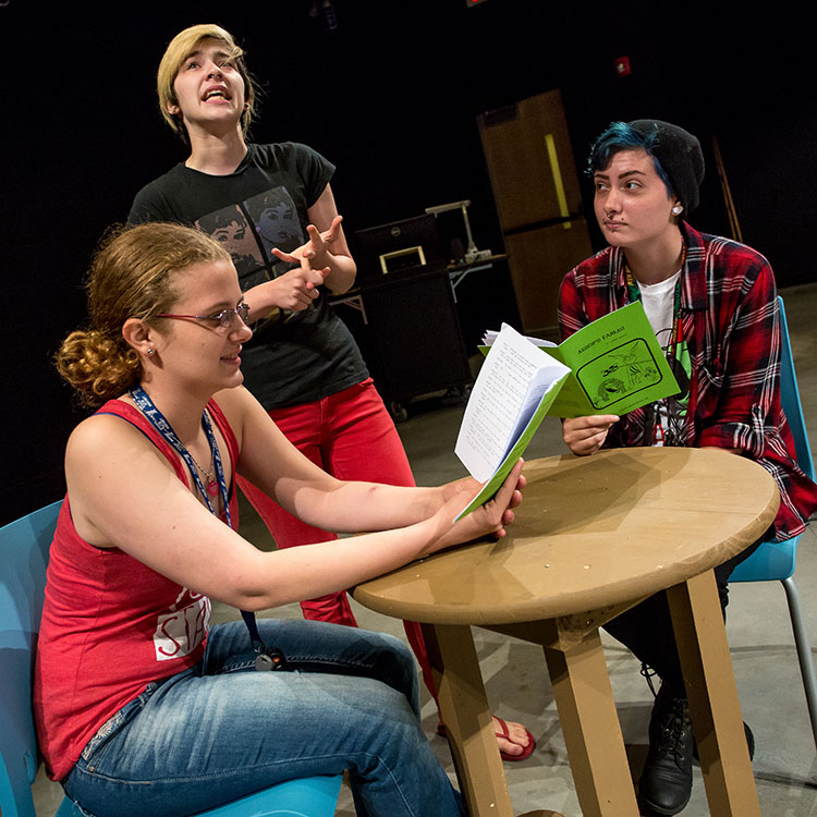 theater students rehearsing on stage