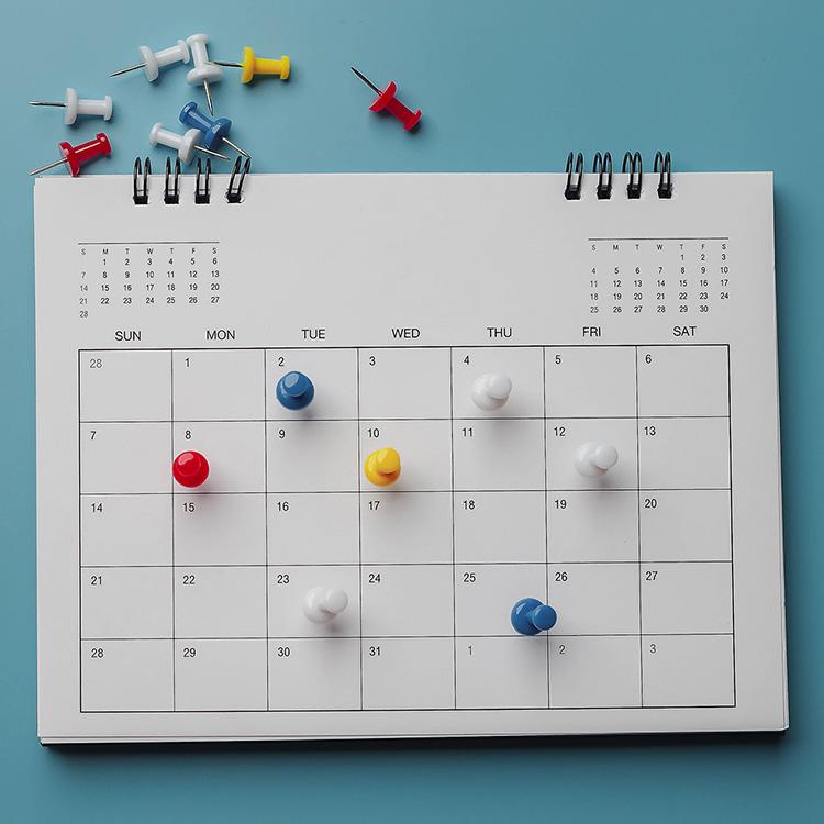 calendar with thumbtacks